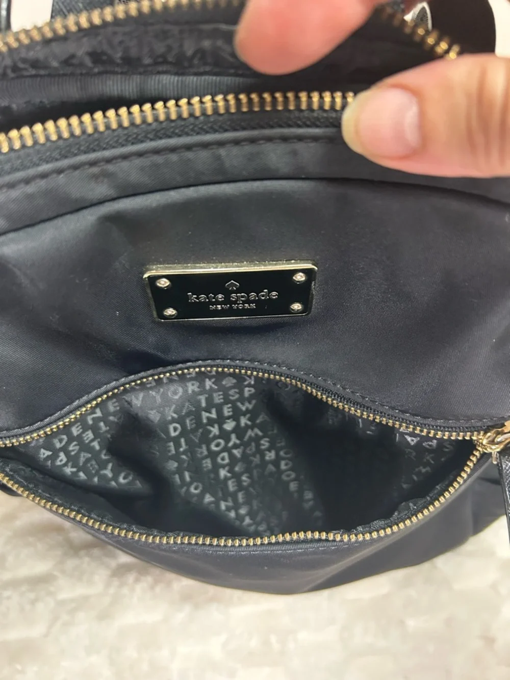 Kate Spade Blake Ave black nylon mini backpack with gold hardware